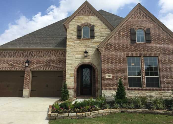 Brick and stone two-car-garage home in Texas
